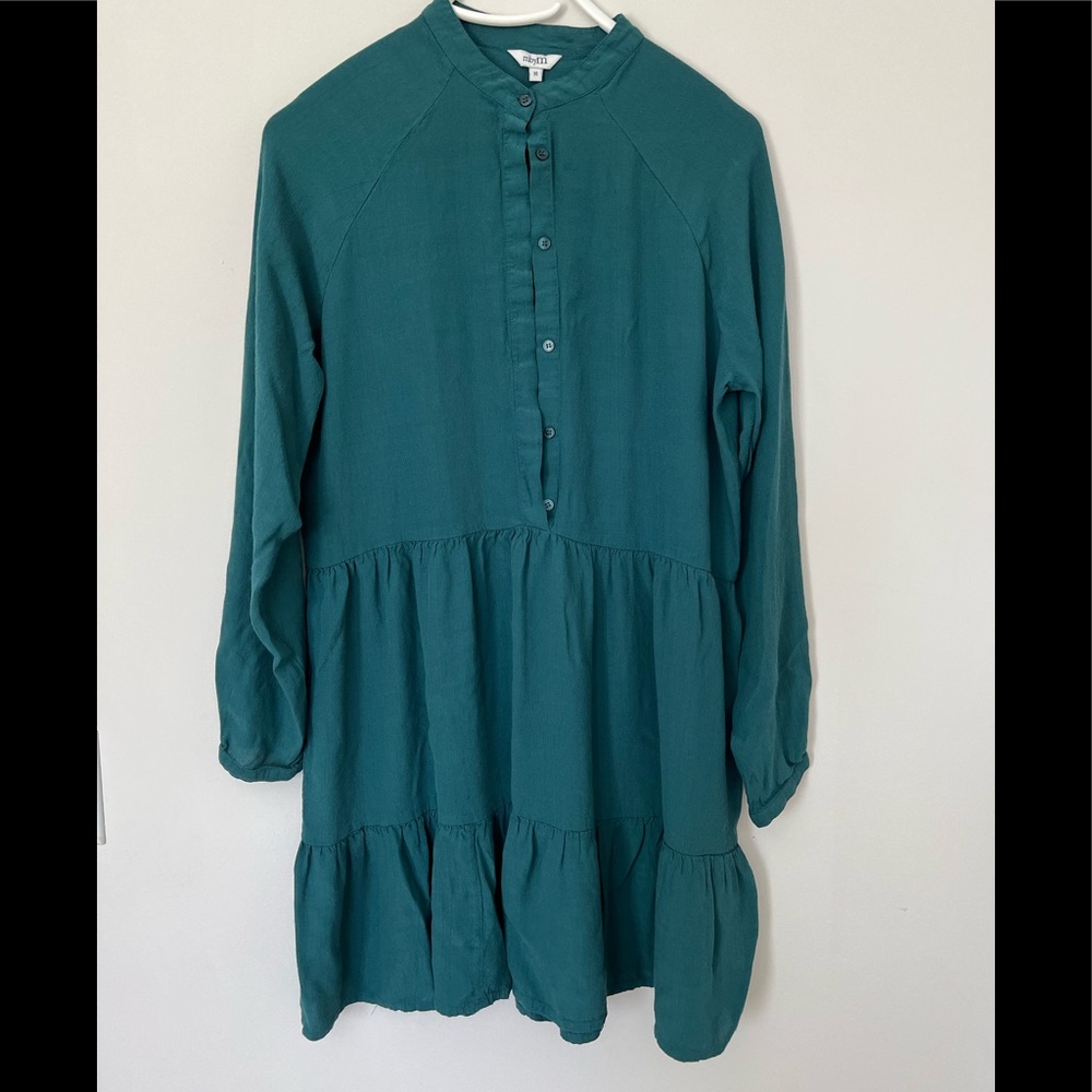 Teal trapeze still dress with wide ruffle.